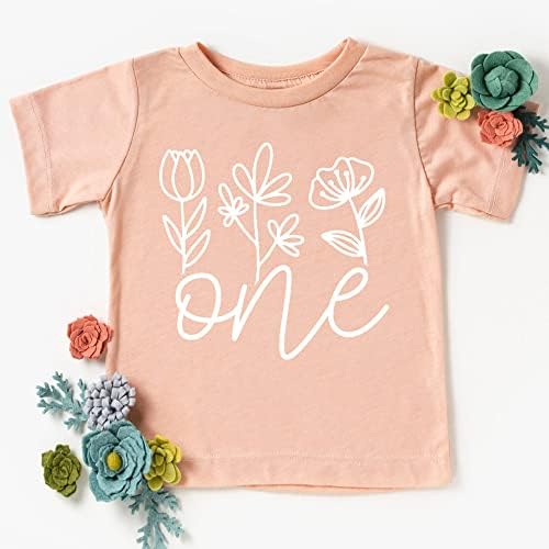 Uma camisa floral de 1º aniversário para meninas de primeiro aniversário